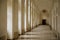 Prague, Czech Republic, 16 July 2023: Long white hallway of Invalidovna, baroque building for war veterans, Repeating pattern of