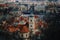 Prague, Czech Republic, 26 March 2023: Panorama of old town from Petrin Hill, Red roofs, Cloudy spring day, bell tower of Church