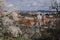 Prague, Czech Republic, 26 March 2023: Panorama of old town from Petrin Hill, Red roofs, Cloudy spring day, lesser town with saint
