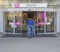 Prague, Czech Republic, April 13, 2019: Man with shopping cart entering door to the new shopping center Vivo Hostivar
