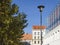 PRAGUE, CZECH REPUBLIC, April 13, 2019: view of Office complex CORSO Karlin with street lamp and maple trees. It is