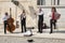 Prague, Czech Republic - April 19, 2011: Quartet of Musicians playing musical instruments for tourists on the street in Prague