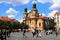 Prague, Czech Republic. Cathedral of St. Nicholas in Old Town against clouds. Church of St. Mikulas, old vintage architecture,