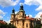 Prague, Czech Republic. Cathedral of St. Nicholas Old Town against clouds. Church of St. Mikulas, old vintage architecture, Praha