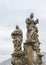 Prague, Czech Republic, Charles bridge. The sculpture `Saints Barbara, Margaret and Elizabeth.`