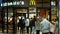 PRAGUE, CZECH REPUBLIC, DECEMBER 22, 2020: Coronavirus mask face mcdonalds fast food restaurant snacks bar shop shopping