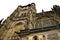 Prague, Czech Republic: Exterior details of St. Vitus Cathedral, a gothic religious building with towers, spires and mosaics