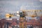 Prague, Czech republic - February 24, 2021. Yellow Liebherr crane in detail above Prague center