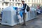 Prague, Czech Republic- March 28, 2018: The man throwing garbage into the waste sorting tanks. Concept to environment preservation