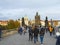 PRAGUE, CZECH REPUBLIC - OCTOBER, 10, 2017: wide angle shot walking across the charles bridge in prague