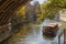 PRAGUE, CZECH REPUBLIC - OCTOBER 13, 2018: The little ship with the tourists on the canal in the Little Quarter