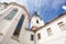 Prague, Czech Republic - October 2015: Exterior view of the Strahovsky Monastery with blue cloud sky