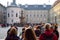 PRAGUE, CZECH REPUBLIC - OKTOBER 10, 2018: Crowd of tourists walk across the square with old buildings in Prague