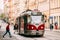 Prague, Czech Republic. Passenger Hurrying On Public Old Retro Tram Of Route Number Seven With Female Woman Driver