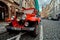 Prague, Czech Republic, September 15, 2017: touristic vintage classic red hot rod car on a cobble road