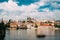 Prague, Czech Republic. Sightseeing Boat Sailing Along Vltava River On Background Upper Town.