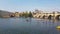 Prague, Czech Republic. Vltava River and Paddle Boarders Under Charles Bridge