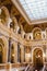 Prague, Czechia - A vertical shot of the interior of The National Museum and its main hall with the predominant use of gold to