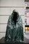 Prague, December 13, 2016: Sightseeing in Prague. Famous sculpture An empty cloak or Cloak of conscience at the entrance