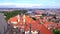 Prague from a height of flight, a beautiful view of the Prague roofs on a sunny day against the background of a beautiful sky