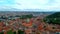 Prague from a height of flight, a beautiful view of the Prague roofs on a sunny day against the background of a beautiful sky