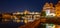 Prague by night. Prague Castle and Charles Bridge reflected in Vltava River. View from Smetana Embankment. Praha, Czech