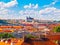 Prague panorama with Prague Castle - Hradcany and red rooftops. Sunny summer day with blue sky and white clouds, Czech