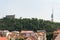 Prague panorama skyline aerial view with Zizkov television tower and equestrian statue in front of National memorial Vitkov