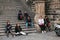 Prague, September 21, 2017: The company of Asian tourists is tired after the tour and rests on the stairs