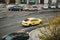 Prague, September 24, 2017: A traditional yellow taxi rides around the city. The other cars are parked on the roadside