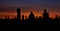 Prague silhouettes from Charles Bridge before dawn