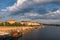 Prague waterfront with restaurants and tourists and waterview buildings