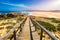 Praia da Bordeira and boardwalks forming part of the trail of tides or Pontal da Carrapateira walk in Portugal. Amazing view of