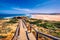 Praia da Bordeira and boardwalks forming part of the trail of tides or Pontal da Carrapateira walk in Portugal. Amazing view of