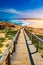 Praia da Bordeira and boardwalks forming part of the trail of tides or Pontal da Carrapateira walk in Portugal. Amazing view of