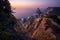 Praia da Ursa Beach at sunset. Flowers in foreground and surreal scenery. Sintra, Portugal, Europe. Atlantic Ocean