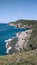 Praia das Conchas, a beautiful blue sea around, big rocks.