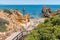 PRAIA DO CAMILO, LAGOS, PORTUGAL, Juner 21th, 2019 -wooden staircase to bathing beach and blue ocean