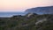 Praia do Guincho beach sand dunes and the coastline at sunset