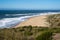 Praia do Norte beach in Nazare Portugal in the winter sunshine