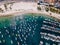 Praia dos Anjos in Arraial do Cabo Brazil. City beach and fishing boats. Beautiful sunny day. Colorful aerial dron photo