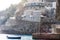 Praiano, Amalfi Coast, Italy, Europe - view of a house on the rocks mountains and a fishermen boat in the sea