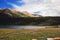 Prairie full of flowers ,High Mountain and Lake Cuopu