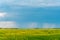 Prairie storms sweep over canola fields