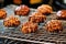 pralines cooling on a wire rack with dripped chocolate