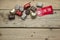 Pralines and red sign on wooden background