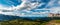 Pralongia high plateau with peaks of the Dolomites around and Zillertal Alps on the background