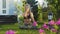 Pranayama yoga breathing practice of woman sitting in lotus pose at backyard