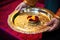 prasad offering placed on a golden plate in a gurdwara