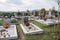 PRASICE, SLOVAKIA - 29.10.2015: Graves, tombstones and crucifixes on traditional cemetery in small village. Votive candles lantern